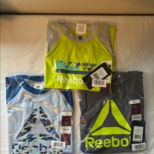 Reebok Trio Short-sleeve Rashguard  T-Shirts